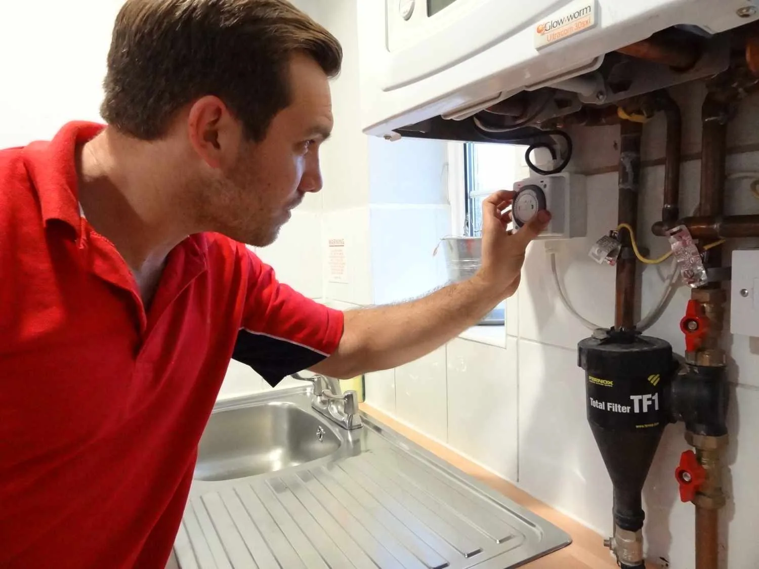 Kingston Plumbers 247 boiler repair engineer working on a boiler in Kingston upon Thames